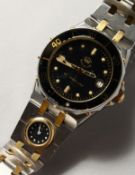 A GENTLEMAN'S GOOD BREITLING WRISTWATCH with a tiny dial on the strap.