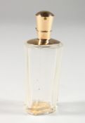 AN 18CT GOLD MOUNTED CUT GLASS SCENT BOTTLE. 3.5ins high.