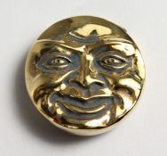 A BRASS DOUBLE SIDED MOON FACE VESTA.