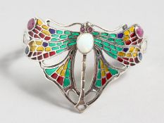AN ART NOUVEAU DESIGN SILVER ENAMEL, OPAL AND RUBY DRAGONFLY BRACELET.