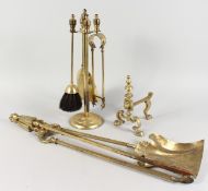 A BRASS FIRESIDE COMPANION SET ON STAND, set of three fireside tools, and a fire dog.