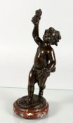 CLODION (1738-1814) FRENCH. A small bronze figure of a semi-nude cherub holding aloift a Jester's