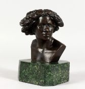 A SMALL BRONZE BUST OF A LADY, mounted on a marble base. 6ins high.