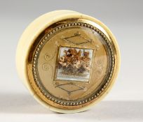 A GEORGIAN CIRCULAR IVORY PILL BOX with floral top. 2ins diameter.