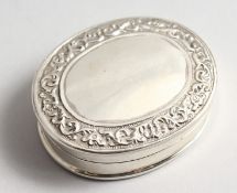 A LARGE SILVER OVAL SECRETS PILL BOX, the interior with a nude.