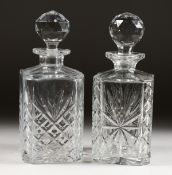 TWO CUT GLASS WHISKY DECANTERS. 10ins high.