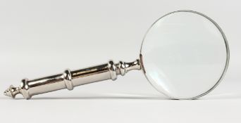 A MAGNIFYING GLASS with plated handle.