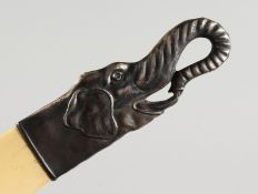 A RUSSIAN SILVER MOUNTED PAGE TURNER, the handle modelled as an elephant head. 10ins long.