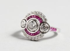 A GOOD SILVER RED AND WHITE CZ CLUSTER RING.