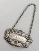 A SILVER BRANDY DECANTER LABEL. London 1971.