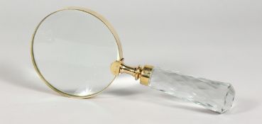 A LARGE MAGNIFYING GLASS with cut glass handle.