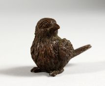 A JAPANESE BRONZE MINIATURE MODEL OF A BIRD. 2ins long.
