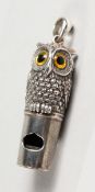 A NOVELTY SILVER OWL WHISTLE.