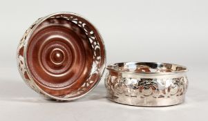 A PAIR OF PLATED BOTTLE COASTERS. 4.75ins diameter.