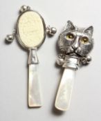 TWO SILVER MOTHER-OF-PEARL CAT BABY'S RATTLES.