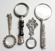 FOUR SILVER MAGNIFYING GLASSES.