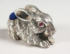 A LARGE SILVER RABBIT PIN CUSHION.