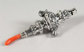 A BABY'S RATTLE with bells and coral mouthpiece.