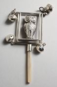 A LARGE SILVER OWL BABY'S RATTLE with four bells.