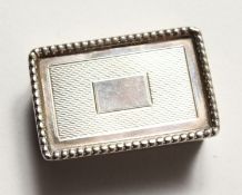 A REEDED AND ENGINE TURNED SNUFF BOX. Birmingham 1968.