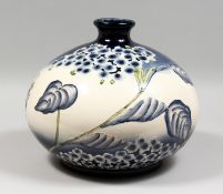 IN THE MANNER OF MOORCROFT, a large bulbous shaped vase. 14ins wide.