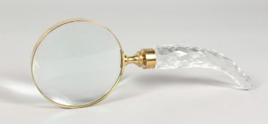 A LARGE MAGNIFYING GLASS with curving cut glass handle.