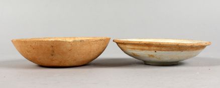 TWO EARLY CHINESE TERRACOTTA BOWLS.
