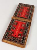 A MOROCCAN LEATHER FOLDING BEZIQUE MARKER.