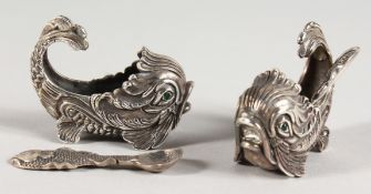 A PAIR OF SILVER DOLPHIN SALTS AND SPOON.