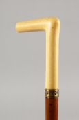 A VICTORIAN MALACCA WALKING STICK with ivory handle and lip. 32ins long.