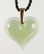 A GREEN LALIQUE HEART PENDANT.