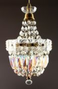A BRASS AND CUT GLASS BAG CHANDELIER. 14ins high.