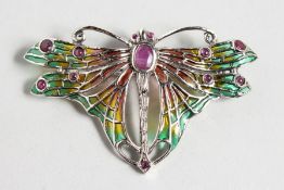 AN ART NOUVEAU DESIGN SILVER AND ENAMEL RUBY SET DRAGONFLY BROOCH.