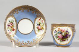A GOOD 18TH CENTURY SEVRES LILAC GROUND CUP AND SAUCER, edged in gilt and painted with flowers