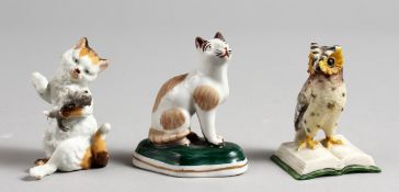 A SMALL PORCELAIN SEATED CAT, in the style of Chelsea, a cat and kitten, and a wise owl (3). 2.5