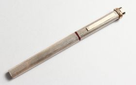 A CARTIER SILVER PEN in a red Cartier box.