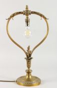 A GOOD FRENCH ORMOLU TABLE LAMP with acanthus and pineapple finial on a circular base. 20ins high.