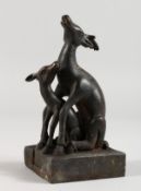 AN UNUSUAL CHINESE BRONZE SEAL MODELLED AS TWO DEER. 5ins high.