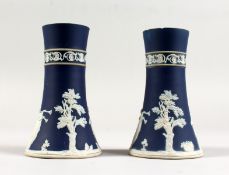 A PAIR OF ADAM'S BLUE AND WHITE JASPER WARE SPILL VASES. 6ins high.