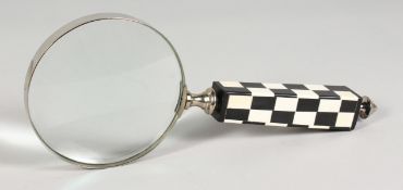A LARGE MAGNIFYING GLASS with black & white handle.