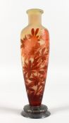 A GALLE GLASS VASE, relief etched with red flowers, on a silver base. 10.5ins high.