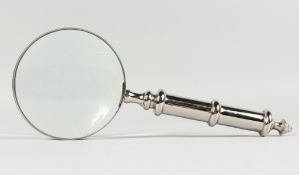 A MAGNIFYING GLASS with plated handle.