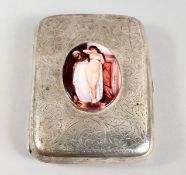 AN ENGRAVED SILVER CIGARETTE CASE, with later enamel plaque of a female nude. 3.5ins x 2.75ins.