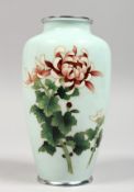 A JAPANESE CLOISONNE VASE, pale blue ground decorated with flowers. 6.25ins high.