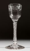 A GEORGIAN WINE GLASS, the bowl engraved with flowers and bird, with white air twist stem. 5.75ins