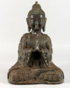 A LARGE BRONZE SEATED BUDDHA. 17ins high.