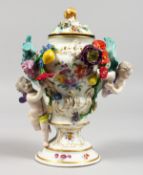A GOOD 18TH CENTURY MEISSEN VASE AND COVER, applied with flowers, fruit and cupids and painted
