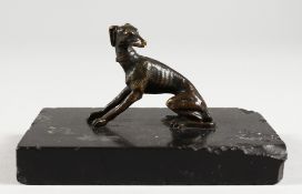 A SMALL 18TH CENTURY BRONZE OF A WHIPPET. 2.25ins wide.