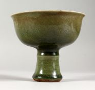 A CHINESE CELADON PORCELAIN STEM CUP. 4.5ins high.