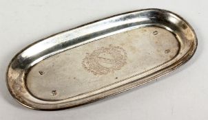 A GEORGE I RECTANGULAR SHAPED SILVER SPOON TRAY with shaped ends, crested. 6.25ins long. London